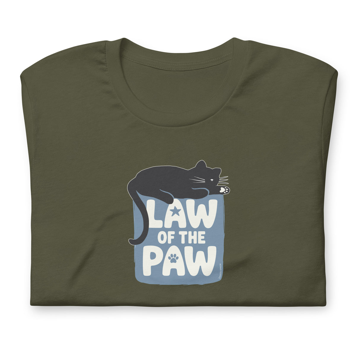 Law of the Paw® design with a cat napping on the logo on a t-shirt in military green, folded close-up of the design – Kate Spain design