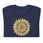 Golden sunflower with a heart center on a crewneck t-shirt in navy, folded close-up of the design – Sunflowers in My Heart by Kate Spain