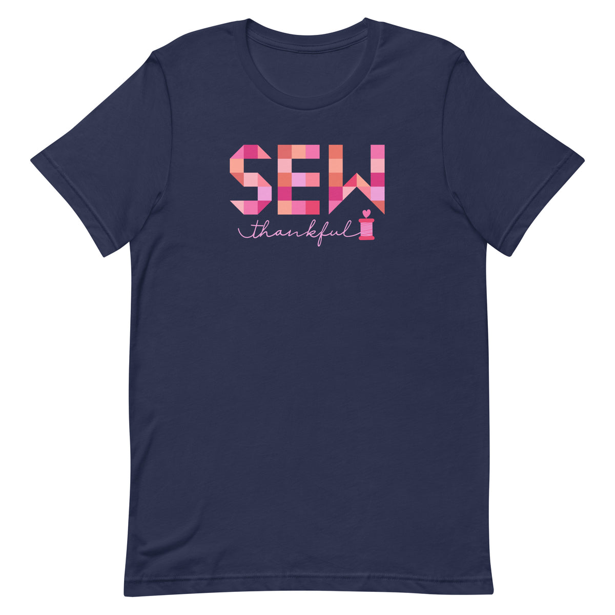 Sew Thankful patchwork lettering with a heart-topped thread spool on a t-shirt in navy, front view – Kate Spain design for Pat Sloan
