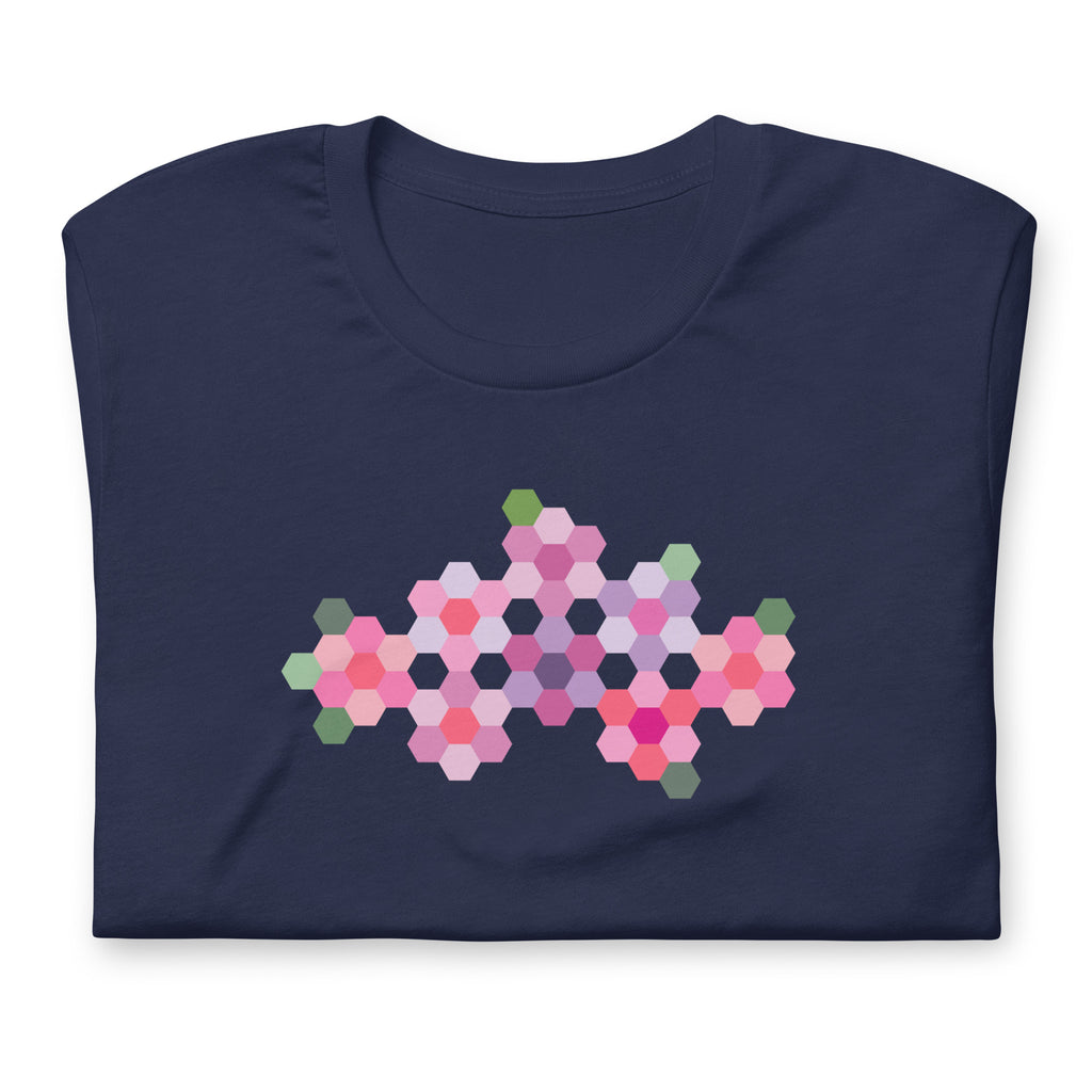 Pink GeoFlora hexagon flowers in pinks, mauves and sage on a t-shirt in navy, folded close-up of the design – Kate Spain design for Pat Sloan