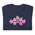 Pink GeoFlora hexagon flowers in pinks, mauves and sage on a t-shirt in navy, folded close-up of the design – Kate Spain design for Pat Sloan
