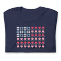 United We Quilt patchwork flag with quilt-block stars and heart stripes on a t-shirt in navy, folded close-up of the design – Kate Spain design for Pat Sloan
