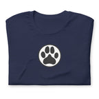 Law of the Paw® dog paw print on a t-shirt in navy, folded close-up of the design – Kate Spain design