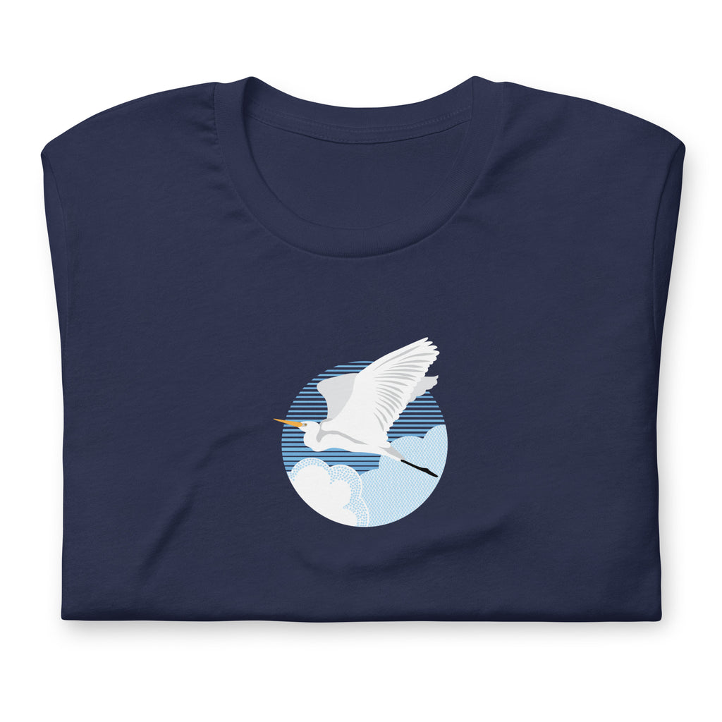Great egret in flight against a blue circle on a t-shirt in navy, folded close-up of the design – Kate Spain design