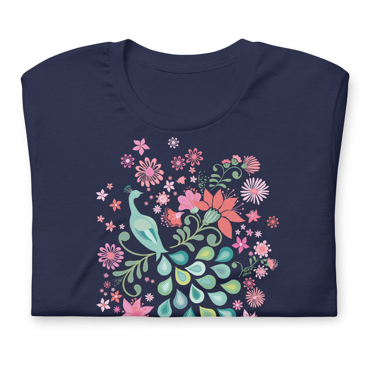 Peacock Flowers design, a peacock among coral, pink, mint and teal blooms on a t-shirt in navy, folded close-up of the design – Kate Spain design