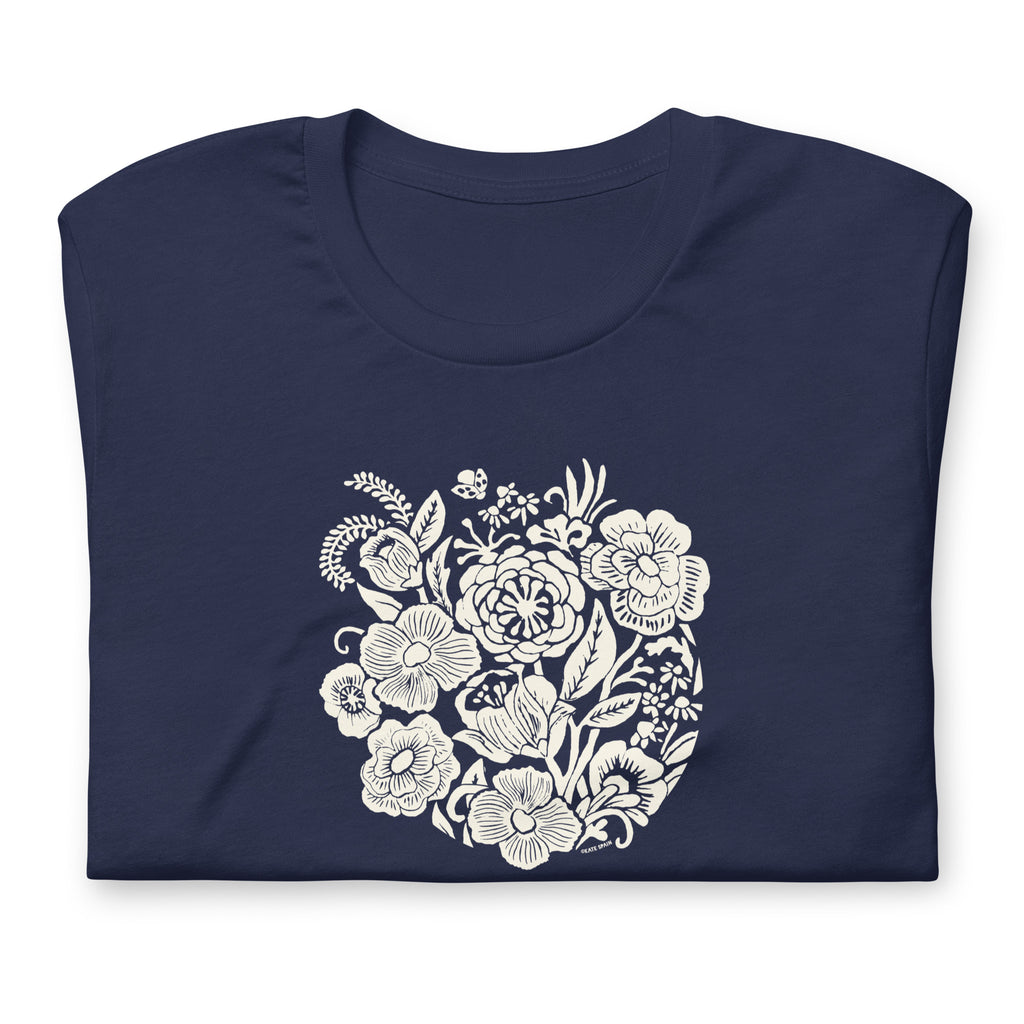 Meadowsweet woodblock-style bouquet of wildflowers on a t-shirt in navy, folded close-up of the design – Kate Spain design