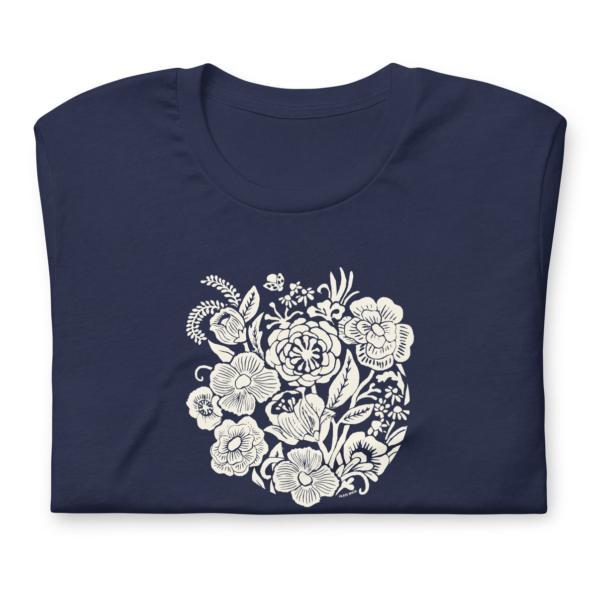 Meadowsweet woodblock-style bouquet of wildflowers on a t-shirt in navy, folded close-up of the design – Kate Spain design