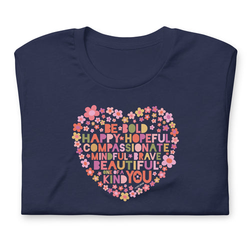Be You floral heart of inspirational words on a staple t-shirt in navy, folded close-up of the design – Kate Spain design