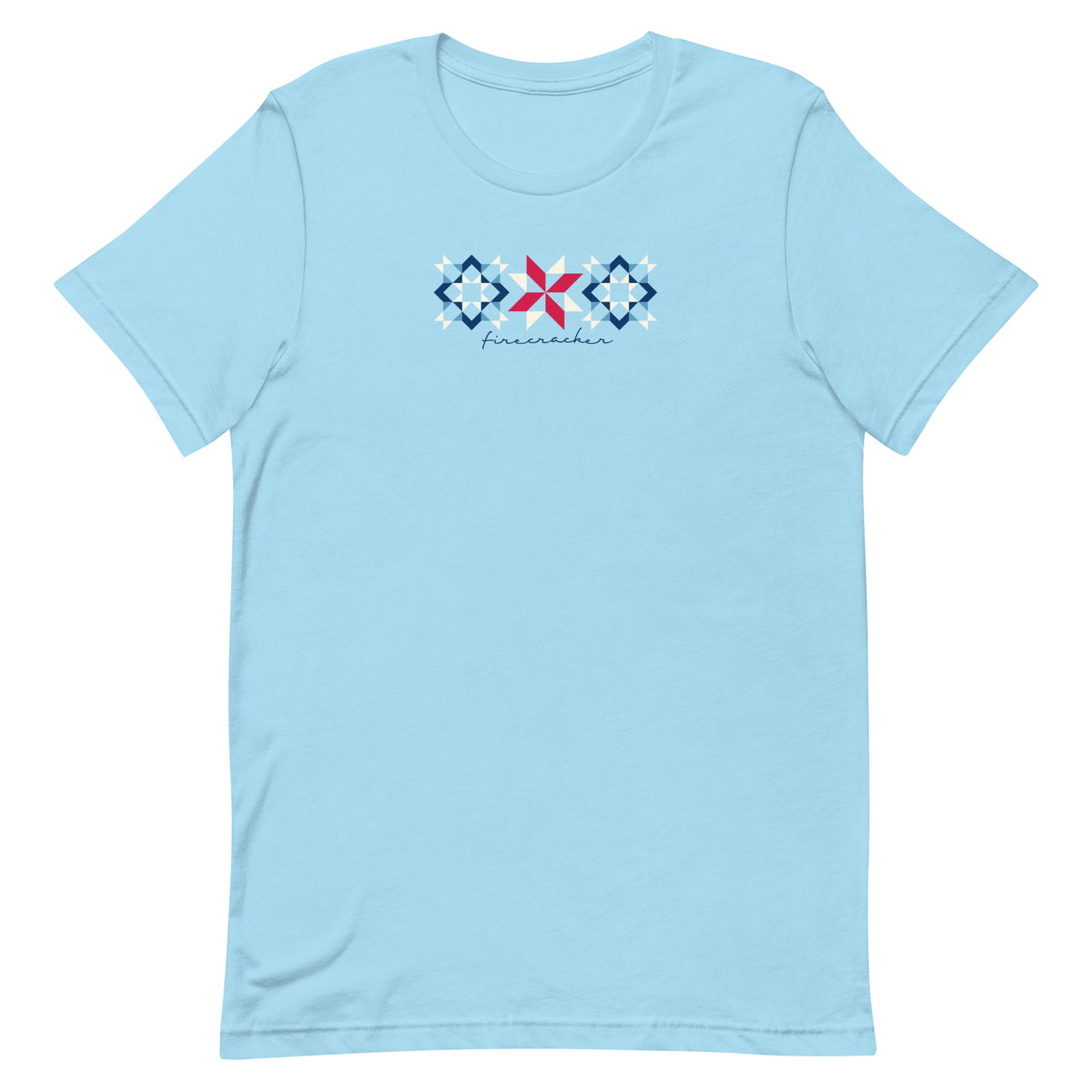 Firecracker quilt-block stars with script lettering in red, white and blue on a t-shirt in ocean blue, front view – Kate Spain design for Pat Sloan