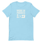 Work in Progress Mod distressed lettering with thread, scissors and sewing machine on a t-shirt in ocean blue, front view – Kate Spain design for Pat Sloan