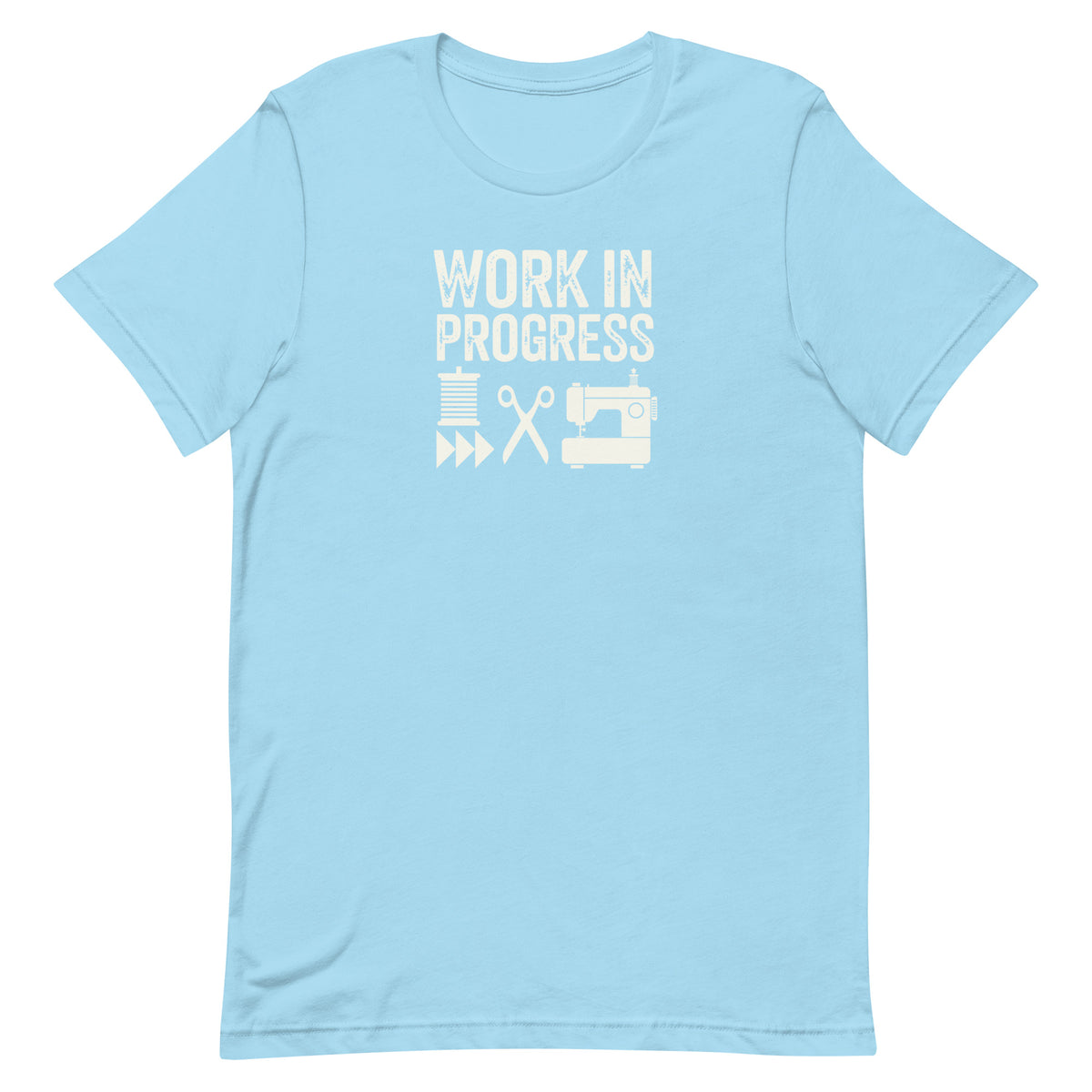 Work in Progress Mod distressed lettering with thread, scissors and sewing machine on a t-shirt in ocean blue, front view – Kate Spain design for Pat Sloan