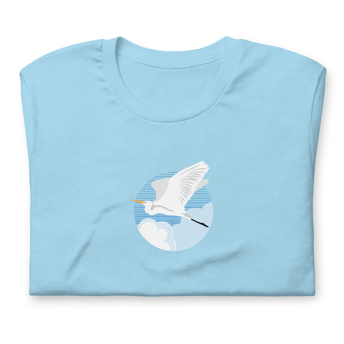 Great egret in flight against a blue circle on a t-shirt in ocean blue, folded close-up of the design – Kate Spain design