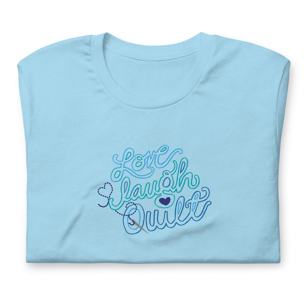 Love Laugh Quilt hand-lettered quilting design on a t-shirt in ocean blue, folded close-up of the design – Kate Spain design