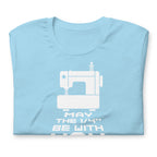 May the ¼" Be With You white sewing machine graphic on a staple t-shirt in ocean blue, folded close-up of the design – Kate Spain design for Pat Sloan