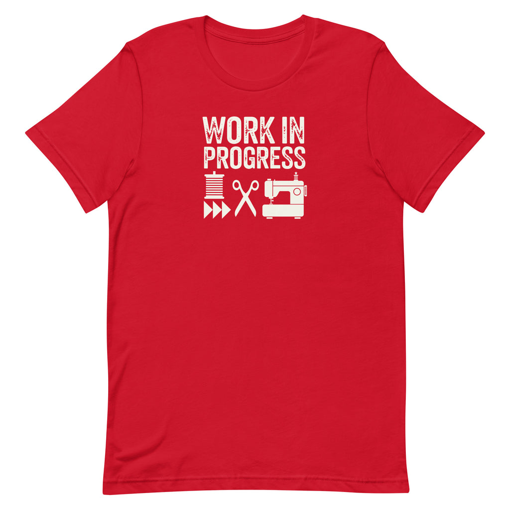 Work in Progress Mod distressed lettering with thread, scissors and sewing machine on a t-shirt in red, front view – Kate Spain design for Pat Sloan