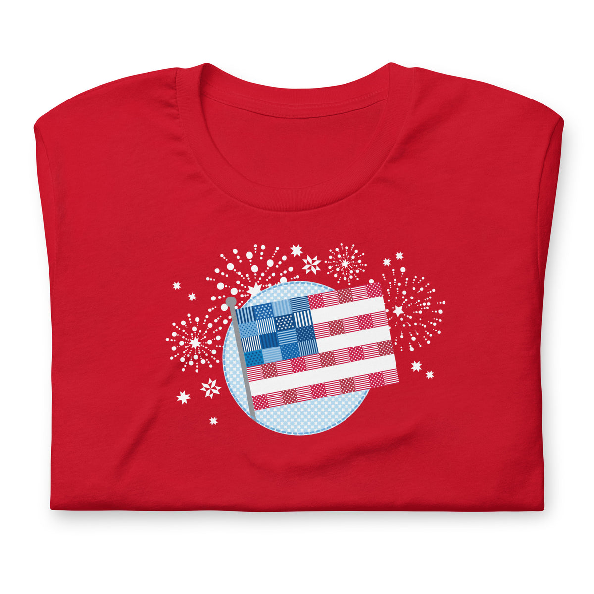 Patchwork Flag quilt-style flag with fireworks on a staple t-shirt in red, folded close-up of the design – Kate Spain design for Pat Sloan