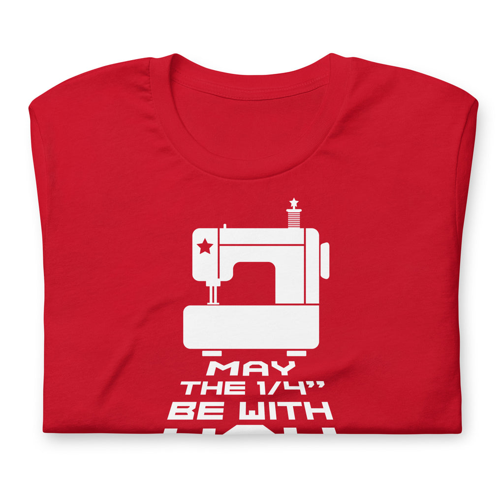 May the ¼" Be With You white sewing machine graphic on a staple t-shirt in red, folded close-up of the design – Kate Spain design for Pat Sloan