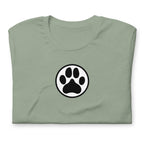 Law of the Paw® dog paw print on a t-shirt in sage, folded close-up of the design – Kate Spain design
