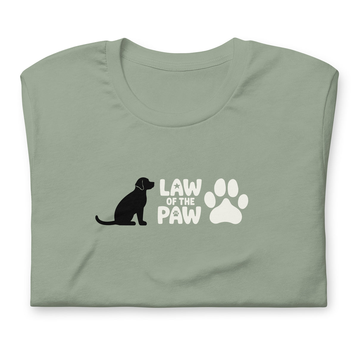 Law of the Paw® logo with seated dog and paw print on a t-shirt in sage, folded close-up of the design – Kate Spain design