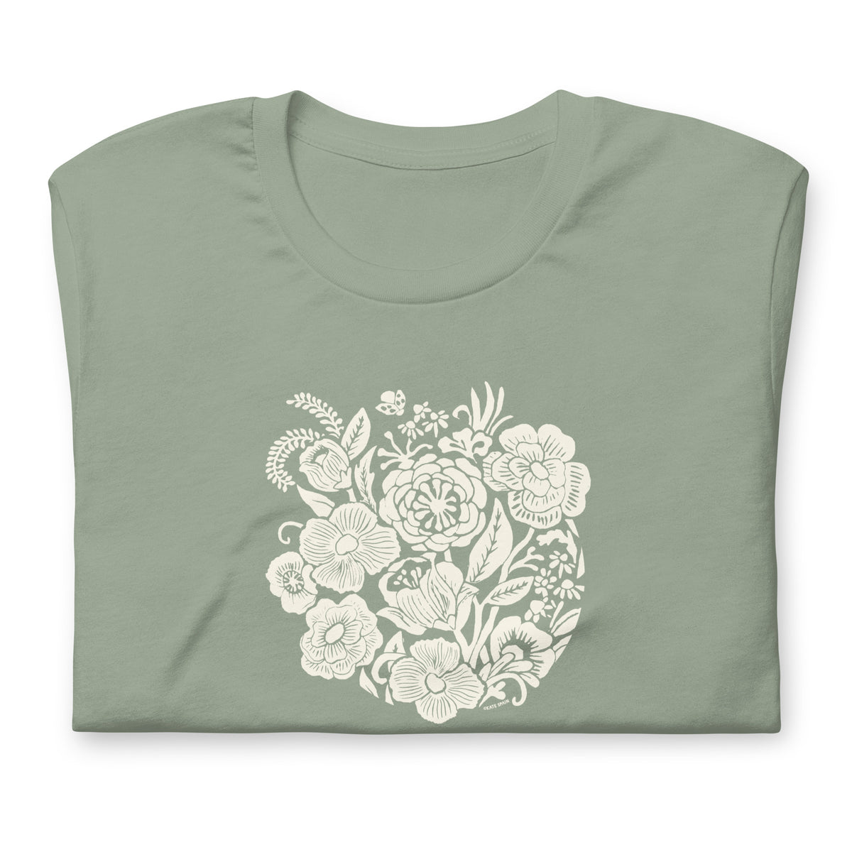 Meadowsweet woodblock-style bouquet of wildflowers on a t-shirt in sage, folded close-up of the design – Kate Spain design
