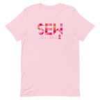 Sew Thankful patchwork lettering with a heart-topped thread spool on a t-shirt in pink, front view – Kate Spain design for Pat Sloan