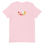 Moda QUILT logo with orange, pink, blue and yellow rays on a staple t-shirt in pink, front view – Kate Spain design