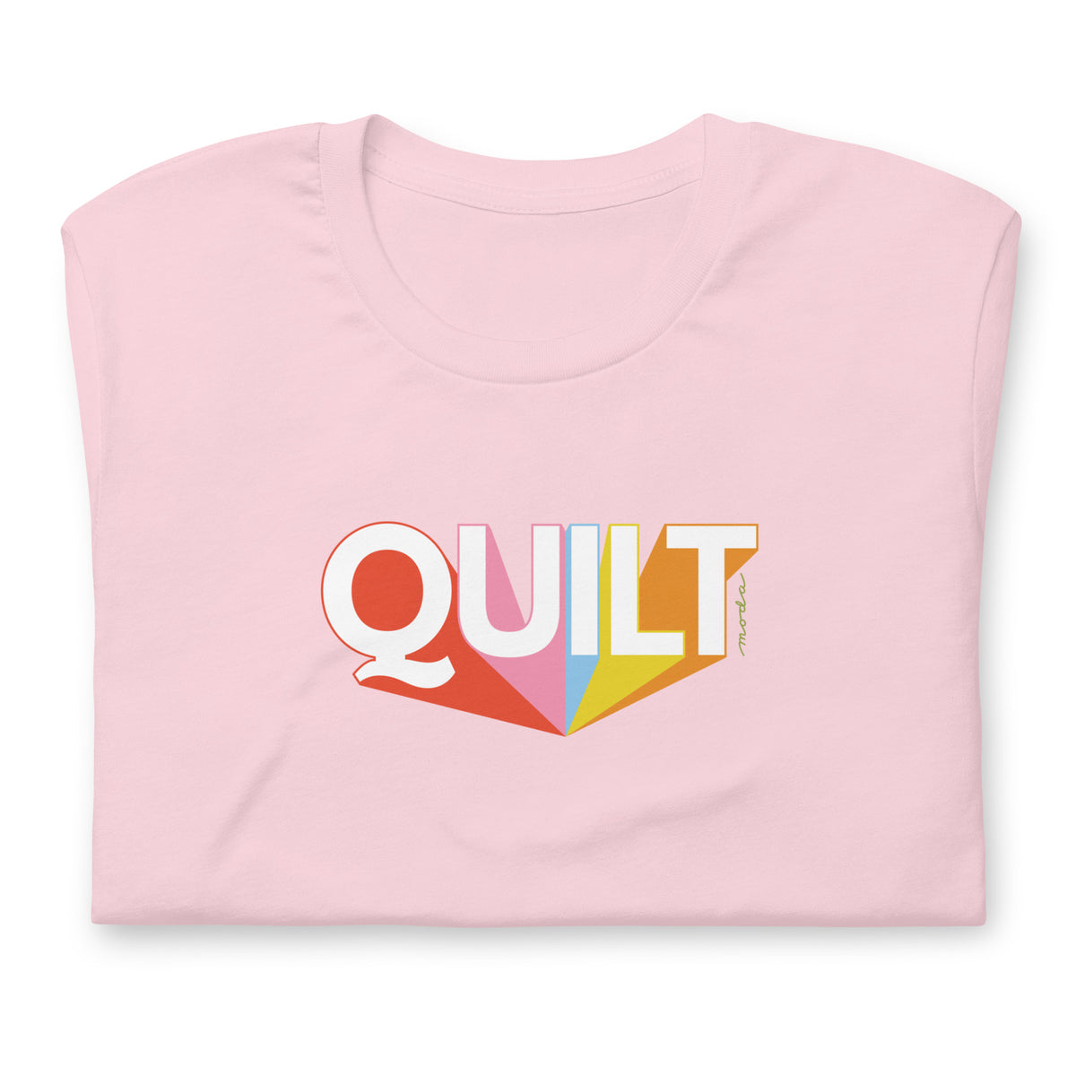Moda QUILT logo with orange, pink, blue and yellow rays on a staple t-shirt in pink, folded close-up of the design – Kate Spain design