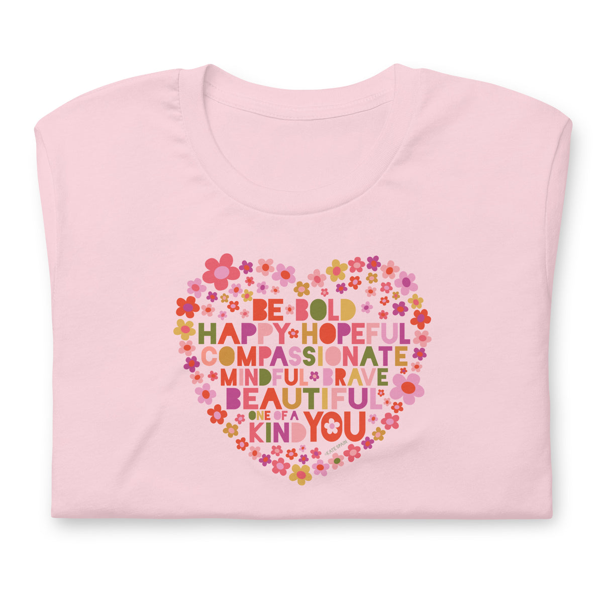 Be You floral heart of inspirational words on a staple t-shirt in pink, folded close-up of the design – Kate Spain design