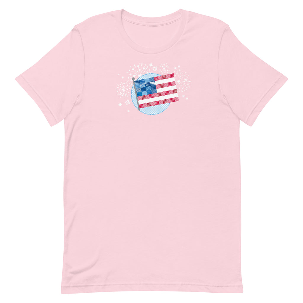 Patchwork Flag quilt-style flag with fireworks on a staple t-shirt in soft pink, front view – Kate Spain design for Pat Sloan