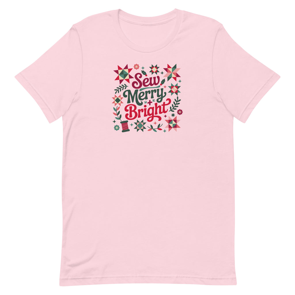 Sew Merry + Bright lettering with quilt stars and holly on a staple t-shirt in soft pink, front view – Kate Spain design for Pat Sloan