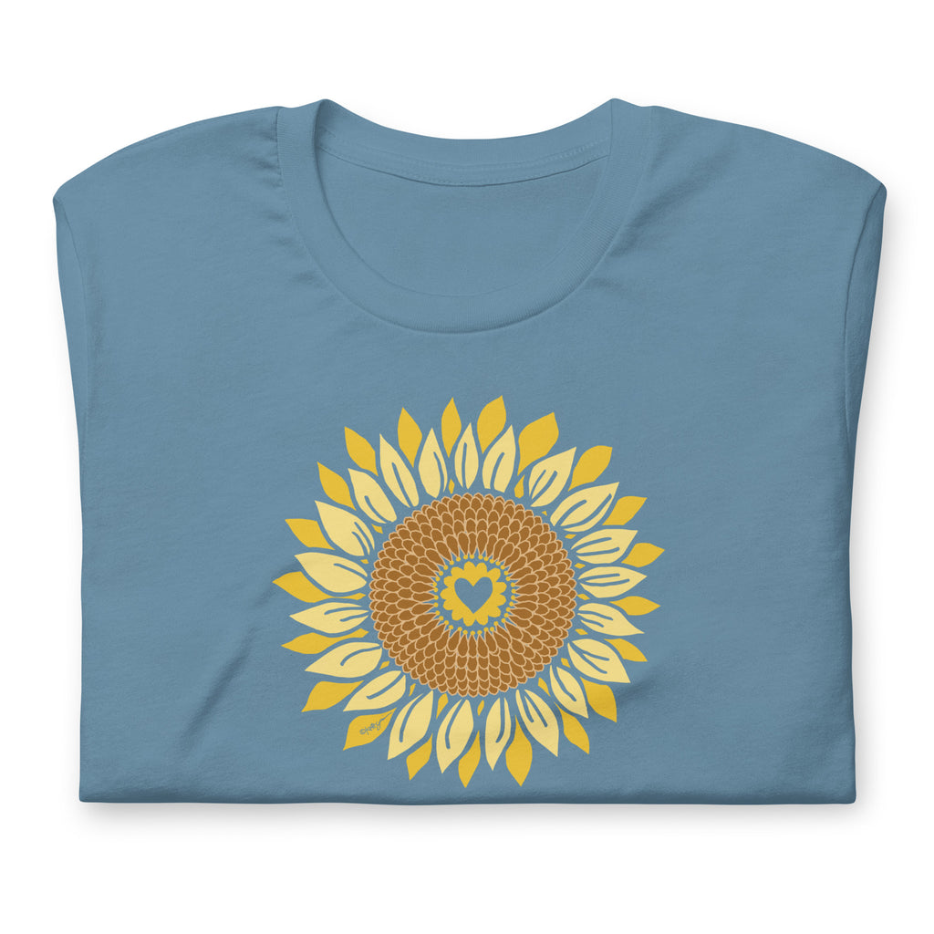 Golden sunflower with a heart center on a crewneck t-shirt in steel blue, folded close-up of the design – Sunflowers in My Heart by Kate Spain