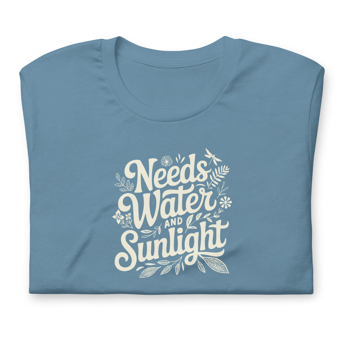 Needs Water + Sunlight hand lettering with leaf and sun accents on a t-shirt in steel blue, folded close-up of the design – Kate Spain design