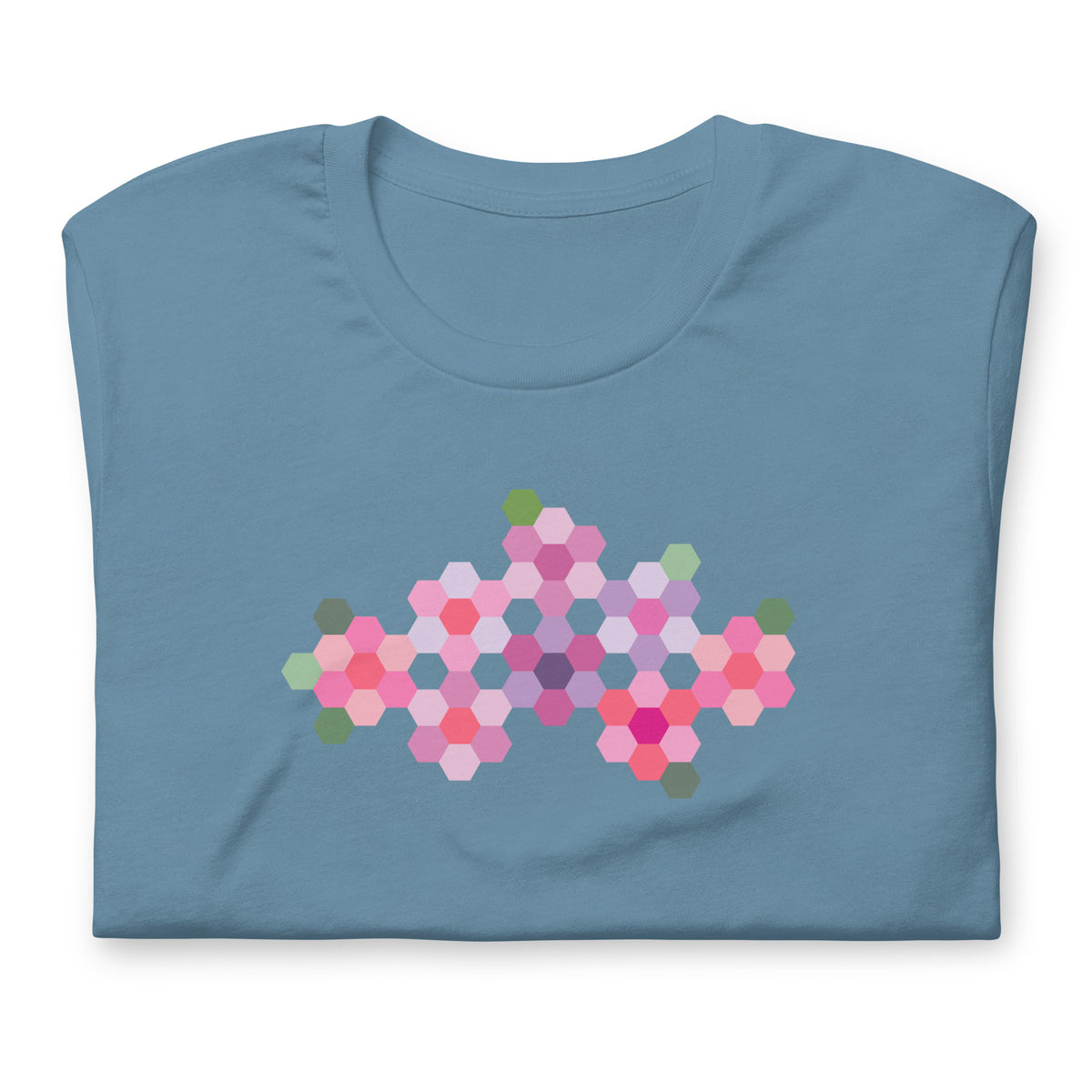 Pink GeoFlora hexagon flowers in pinks, mauves and sage on a t-shirt in steel blue, folded close-up of the design – Kate Spain design for Pat Sloan