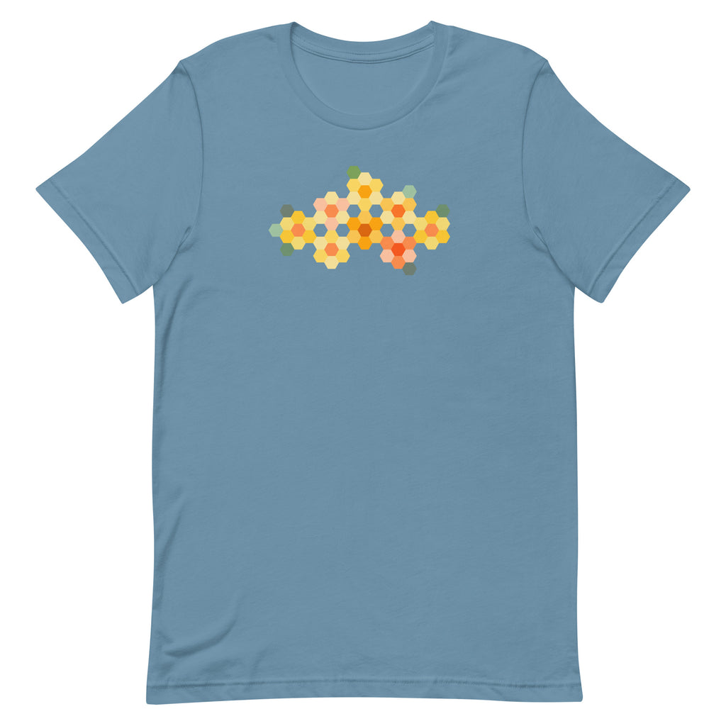 Yellow GeoFlora hexagon flowers in golden yellow, orange, coral and sage on a t-shirt in steel blue, front view – Kate Spain design for Pat Sloan