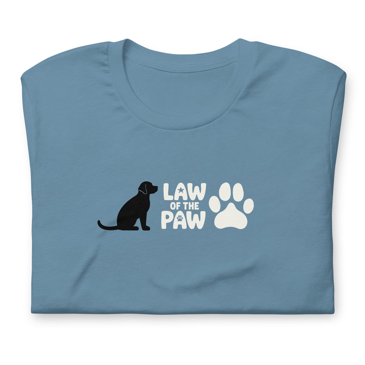 Law of the Paw® logo with seated dog and paw print on a t-shirt in steel blue, folded close-up of the design – Kate Spain design