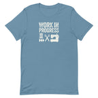 Work in Progress Mod distressed lettering with thread, scissors and sewing machine on a t-shirt in steel blue, front view – Kate Spain design for Pat Sloan