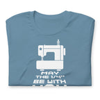 May the ¼" Be With You white sewing machine graphic on a staple t-shirt in steel blue, folded close-up of the design – Kate Spain design for Pat Sloan