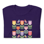 Birds + Blooms patchwork tulips and birds on a t-shirt in purple, folded close-up of the design – Kate Spain design for Pat Sloan