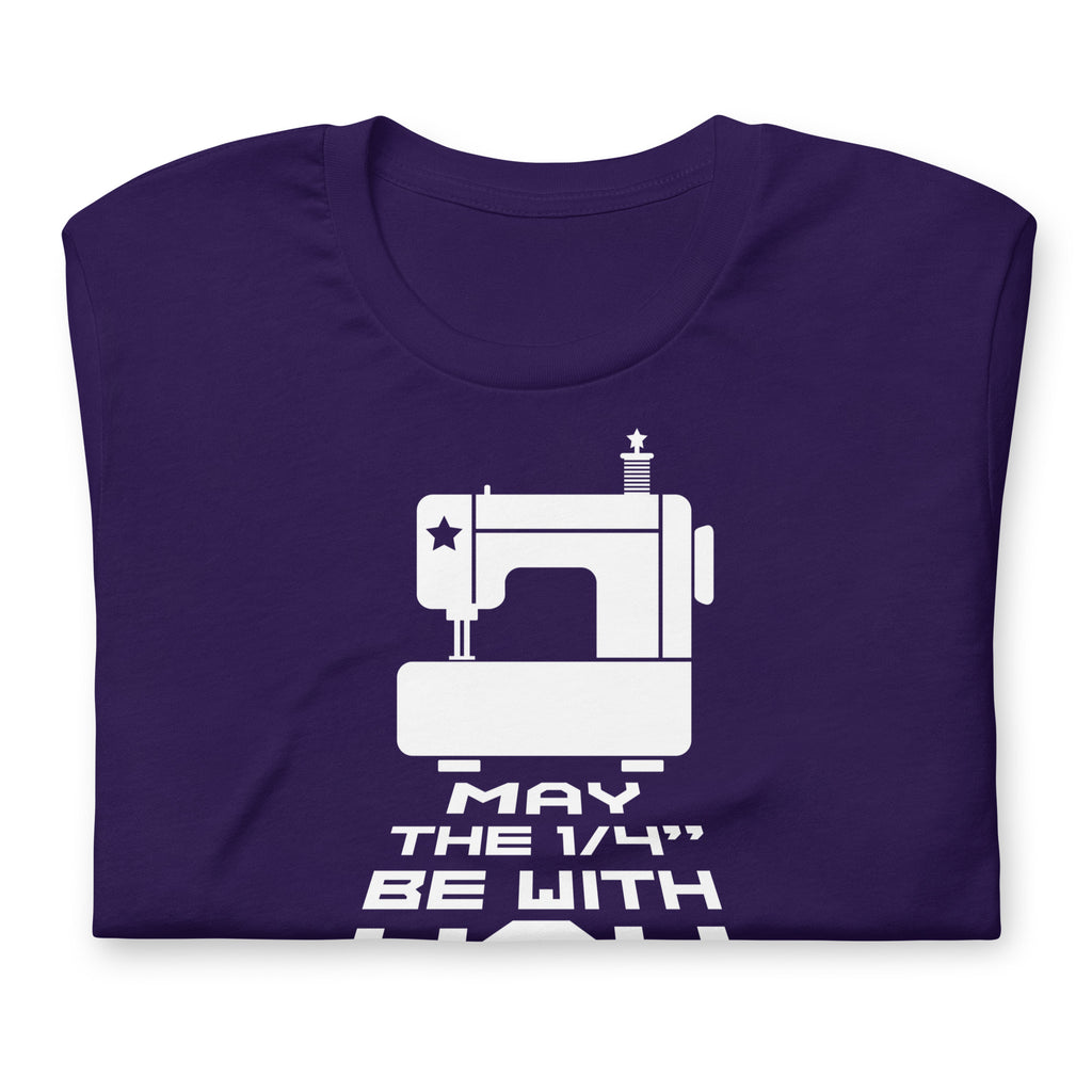 May the ¼" Be With You white sewing machine graphic on a staple t-shirt in purple, folded close-up of the design – Kate Spain design for Pat Sloan