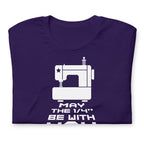 May the ¼" Be With You white sewing machine graphic on a staple t-shirt in purple, folded close-up of the design – Kate Spain design for Pat Sloan
