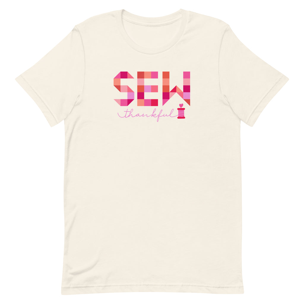 Sew Thankful patchwork lettering with a heart-topped thread spool on a t-shirt in vintage white, front view – Kate Spain design for Pat Sloan