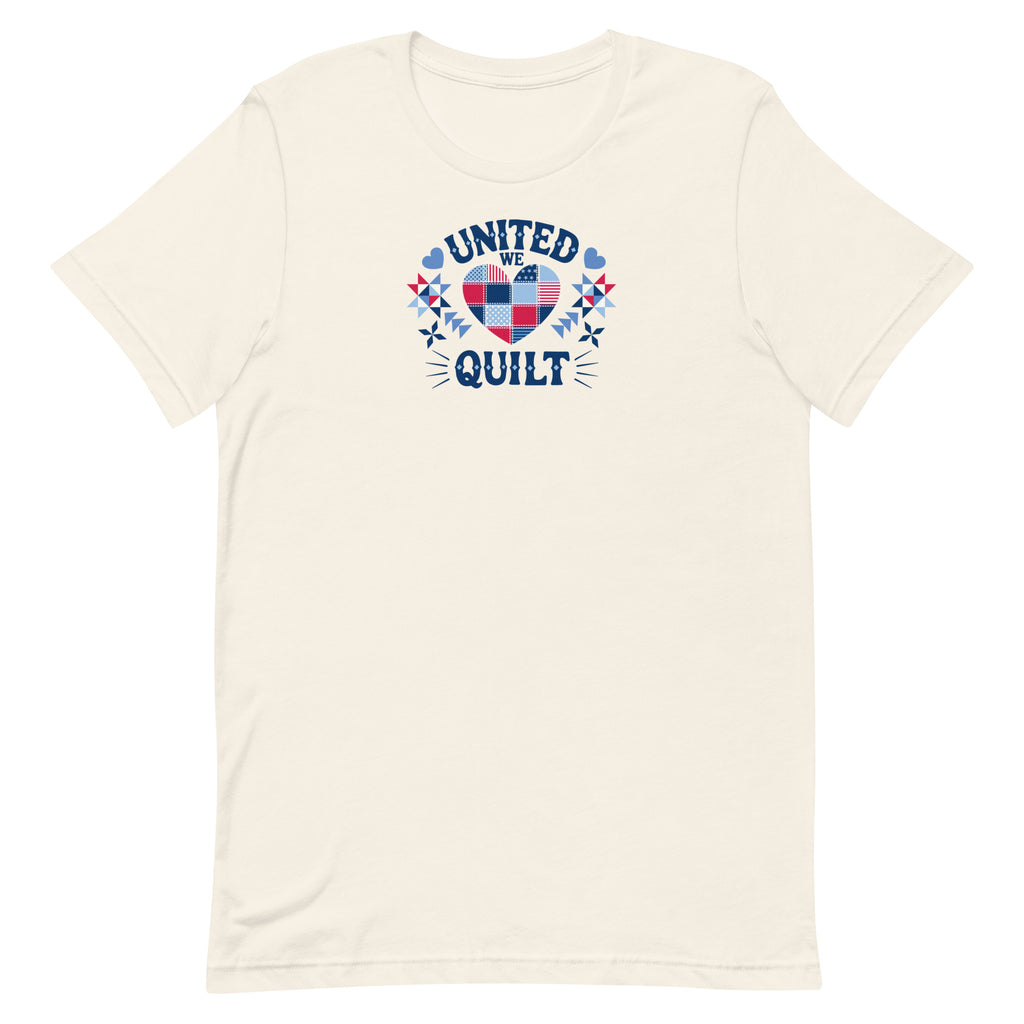 Quilters United quilt badge in red, white and blue on a t-shirt in vintage white, front view – Kate Spain design for Pat Sloan