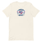 Quilters United quilt badge in red, white and blue on a t-shirt in vintage white, front view – Kate Spain design for Pat Sloan