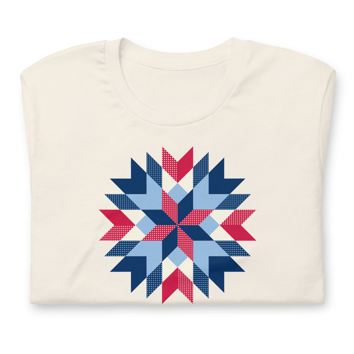 Barn Star quilt block in red, white and blue on a staple t-shirt in vintage white, folded close-up of the design – Kate Spain design for Pat Sloan