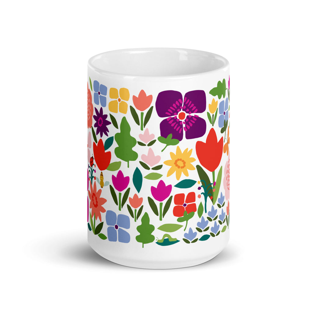 Happy Blooms 15 oz ceramic mug with bright red, purple and coral flowers, front view – Kate Spain design