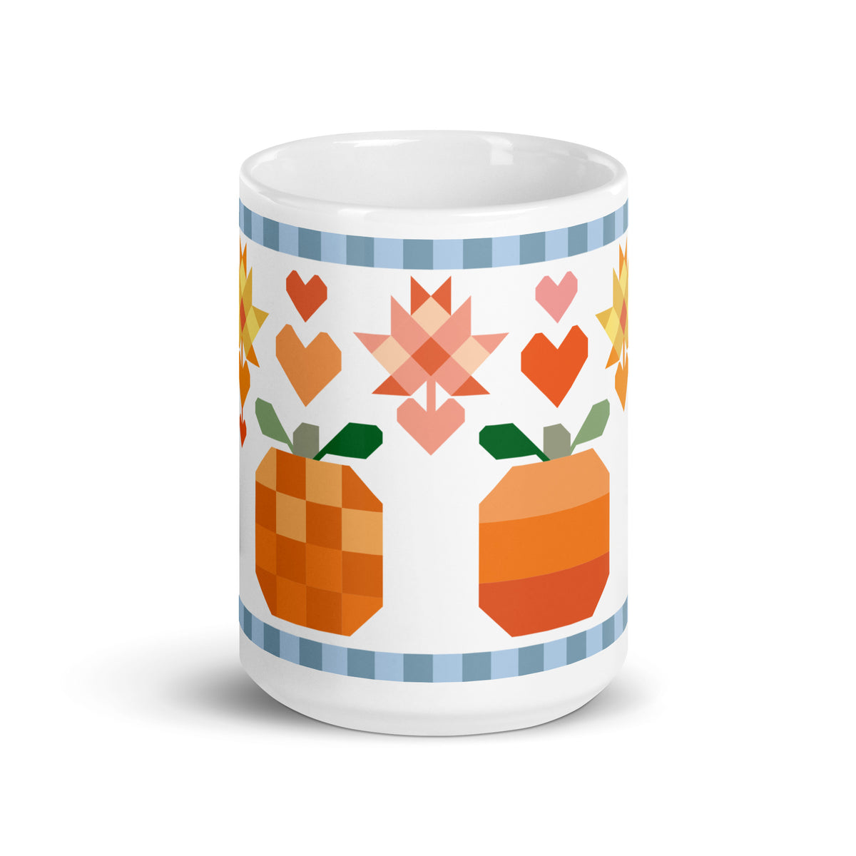 15 oz ceramic mug with the Falling for Fall patchwork pumpkin, quilt-block stars and hearts, front view – Kate Spain design for Pat Sloan