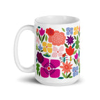 Happy Blooms 15 oz ceramic mug with bright red, purple and coral flowers, handle on the left – Kate Spain design