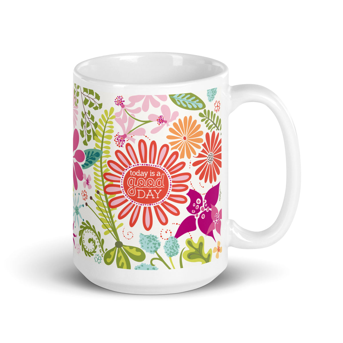 Terrain 15 oz ceramic mug with bold hot pink, orange and aqua flowers with ferns and “today is a good day” in the center flower, handle on the right – Kate Spain design