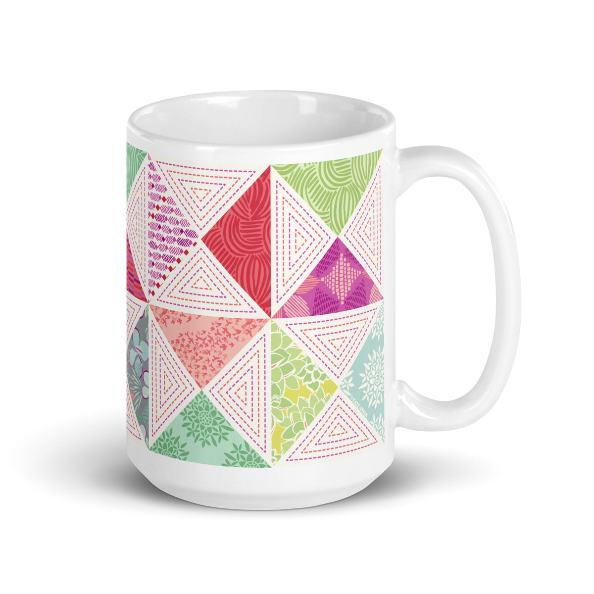 Canyon 15 oz ceramic mug with pink, green and coral quilt-block triangles, handle on the right – Kate Spain design