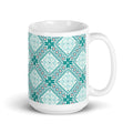 Chalet Turquoise 15 oz ceramic mug with teal Nordic diamond and snowflake pattern, handle on the right – Kate Spain design